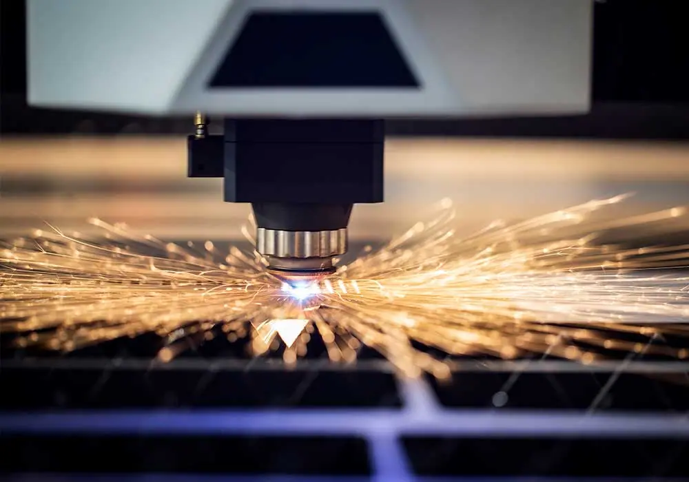Fibre laser cutting steel sheet with sparks